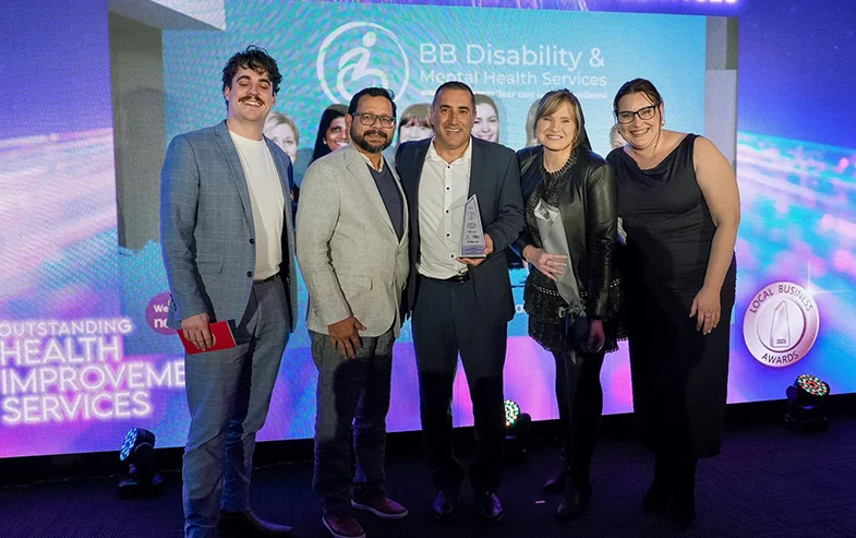 Group accepting a community award