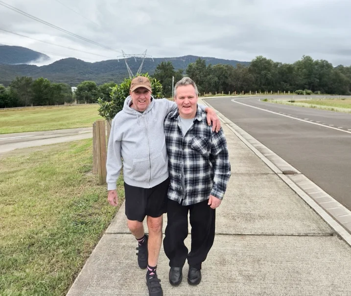 Home Bottom Disability participants walking outdoors together