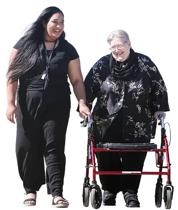 Disability support worker with participant using walker